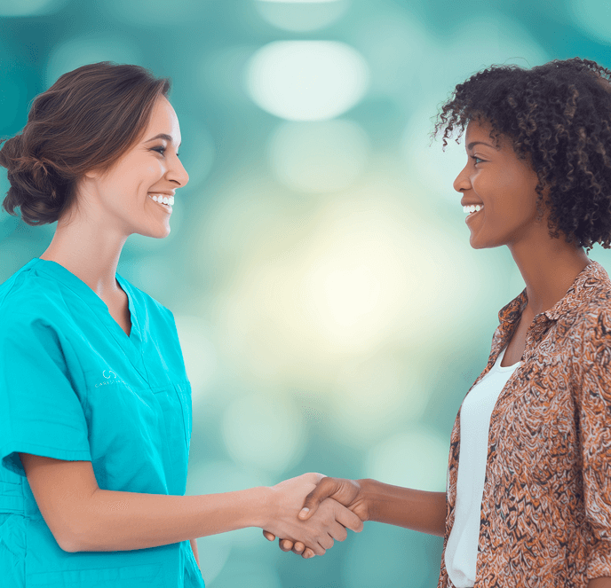 Two women shaking hands